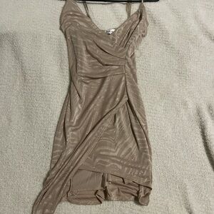 Woman’s gold dress with white stripes